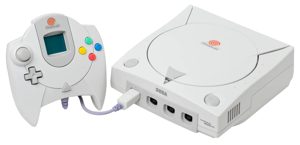 A Sega Dreamcast console with its controller and a VMU memory card
