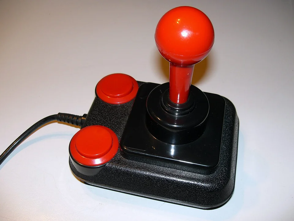 A Competition Pro joystick, the black base and red fire buttons common on Commodore 64 setups
