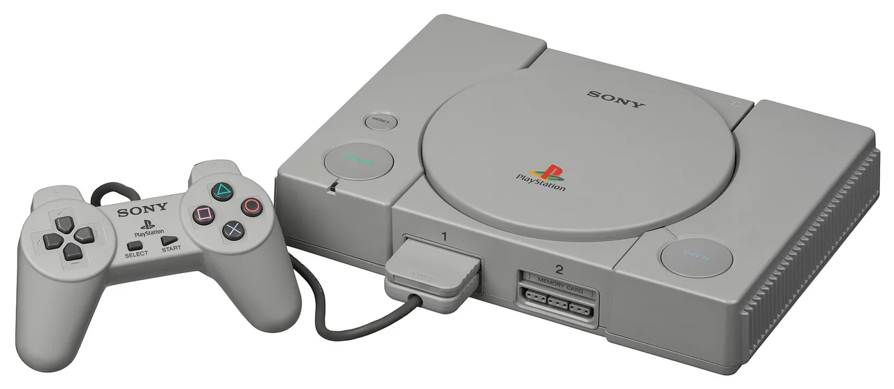 An original Sony PlayStation console with controller and memory card