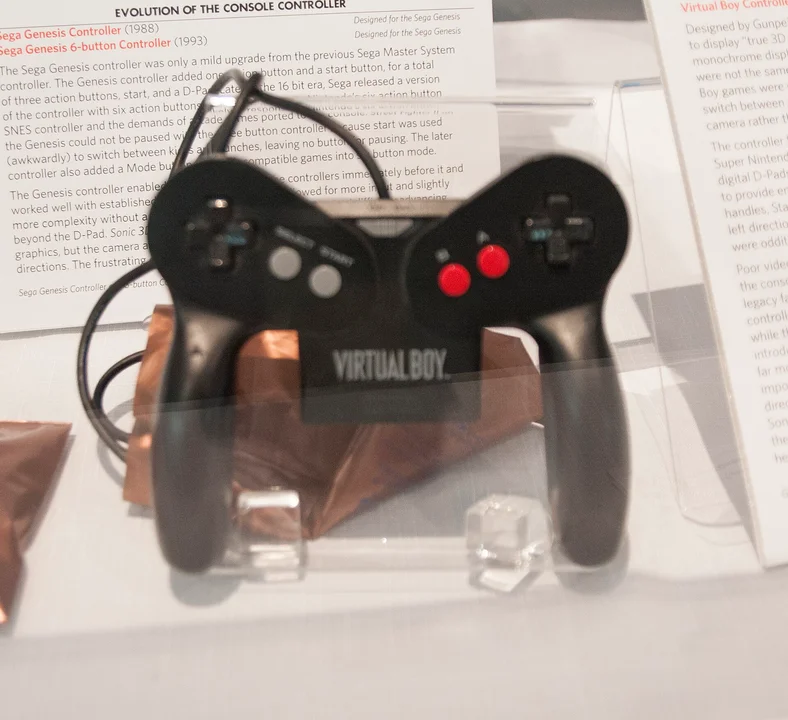 A Virtual Boy console on display in a retro gaming museum exhibit